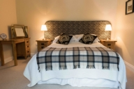 The double bedroom is warm, modern & comfortable